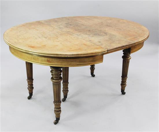 A Victorian walnut oval extending dining table, extends to 6ft 7in.